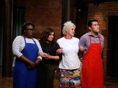 Blue team finalist Ann Odogwu, mentors Rachael Ray and Anne Burrell and red team finalist Daniel Mar link arms as they await the guest judges' decision, as seen on Food Network's Worst Cooks in America, Season 10.
