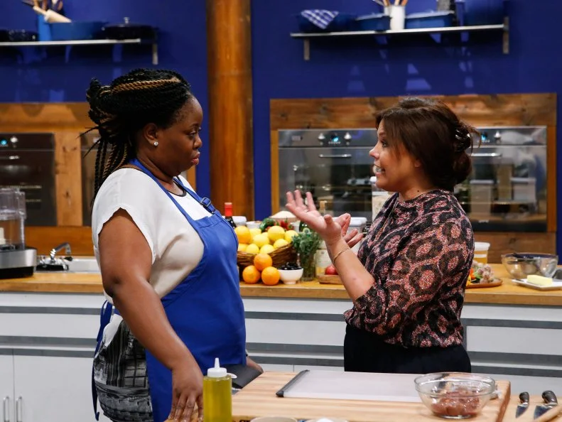 Mentor Rachael Ray helps blue team finalist Ann Odogwu during a practice cook ahead of the finale, as seen on Food Network's Worst Cooks in America, Season 10.