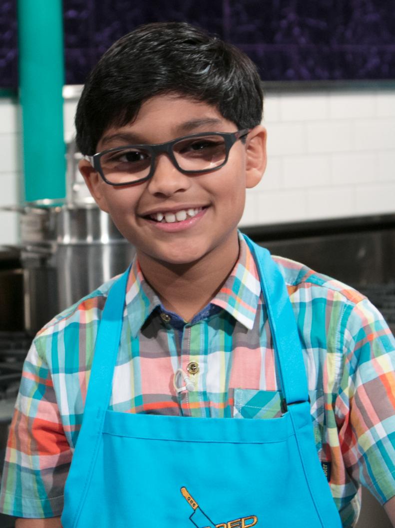 Junior contestant Arjun Ray poses on set, as seen on Food Network's Chopped Junior, Season 6.