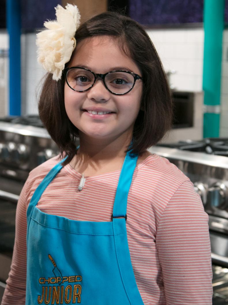 Junior contestant Olivia Acosta poses on set, as seen on Food Network's Chopped Junior, Season 6.