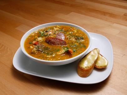 Mentor Rachael Ray's New Orleans-Style Bouillabaisse with Garlic Aioli dish is displayed, as seen on Food Network's Worst Cooks in America, Season 10.