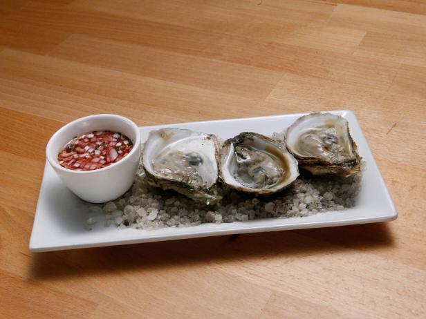 Mentor Anne Burrell's Oysters on the Half Shell with Mignonette Sauce dish is displayed, as seen on Food Network's Worst Cooks in America, Season 10.