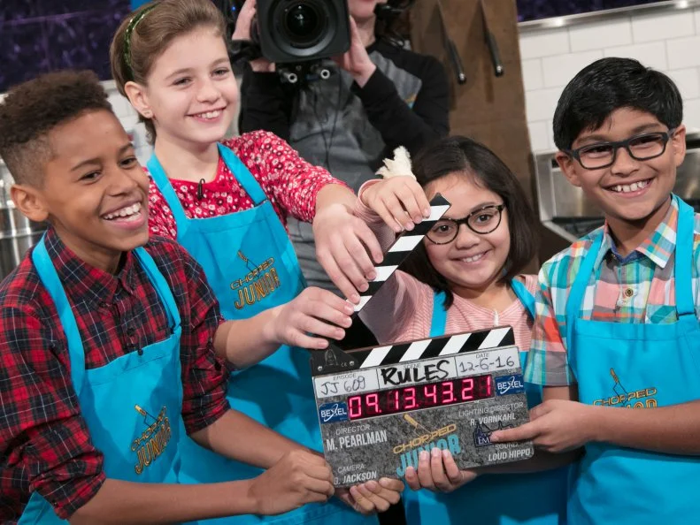 Junior contestants Tyler Casanova-Rodriguez (L), Nicole Bidun, Olivia Acosta, and Arjun Ray on set, as seen on Food Network's Chopped Junior, Season 6.