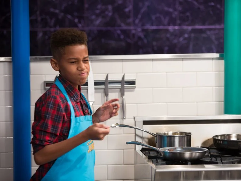 Junior contestants Tyler Casanova-Rodriguez cooks Venison slider with a sweet pickle vinaigrette during the appetizer round, as seen on Food Network's Chopped Junior, Season 6.