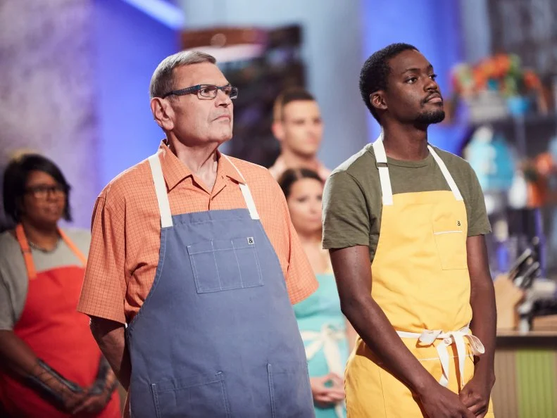 Chefs John Reed and Mark Heyward-Washington during elimination, as seen on Food Network's Spring Baking Championship, Season 3.
