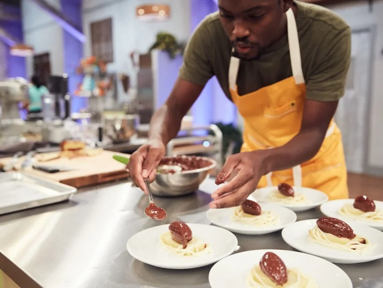 Chef Mark Heyward-Washington preparing his Pre-Heat dish, Orange Buttermilk Poundcake & White Chocolate Nest with Dark Chocolate Mousse Eggs, as seen on Food Network's Spring Baking Championship, Season 3.