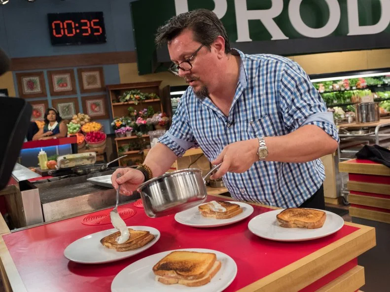 Contestant Tom Ramsey puts the finishing touches on his dish, as seen on Food Network's Guy's Grocery Games, Season 12.