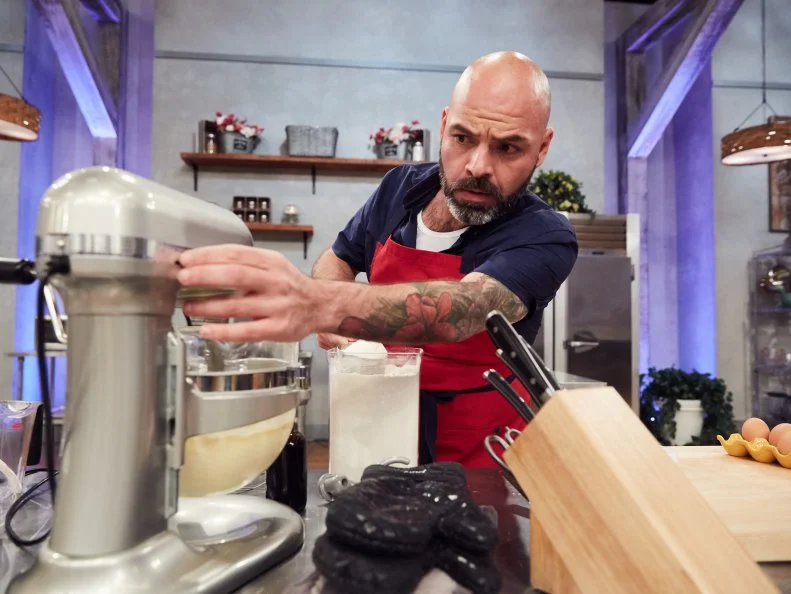 Chef Fausto Barragan preparing his Pre-Heat dish, Vanilla Cookie with Strawberry Basil Consomme, Mascarpone Whipped Cream and Phyllo Dough Nest, as seen on Food Network's Spring Baking Championship, Season 3.