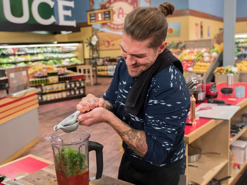Contestant Samuel Monsour prepares his dish, as seen on Food Network's Guy's Grocery Games, Season 12.