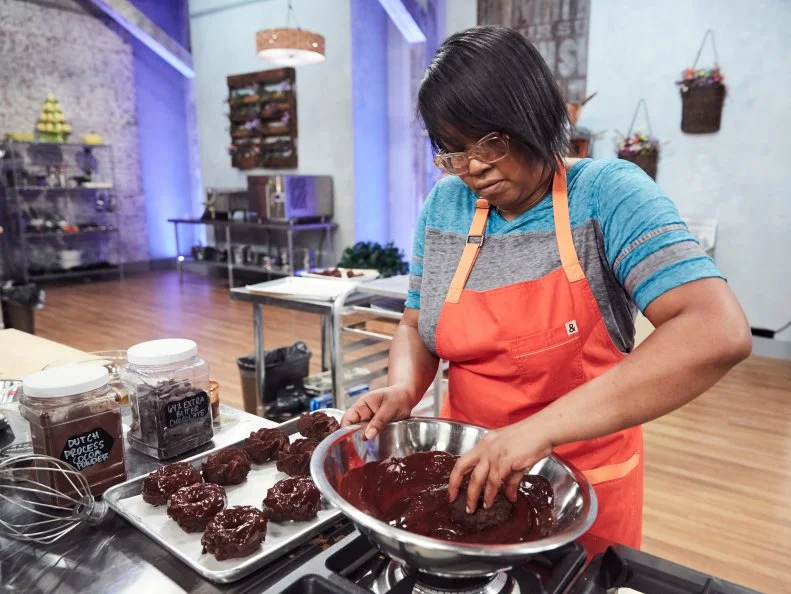 Chef Samirah Williams preparing her Main Heat dish, Chocolate Espresso Cake Doughnuts with Hazelnut Ganache, as seen on Food Network's Spring Baking Championship, Season 3.