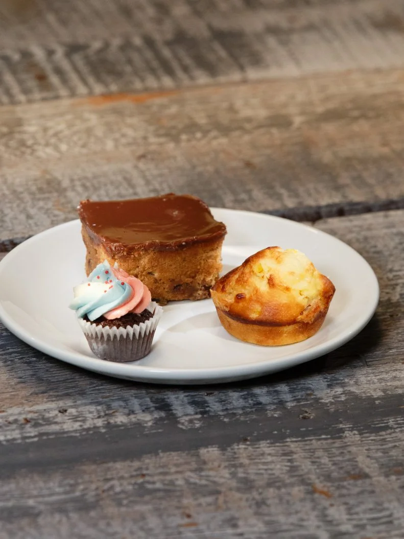A trio of desserts -- including pancetta swiss cornbread, chocolate strawberry cupcake, and blondie -- prepared by Jordan Pilarski during the sweet-and-savory-themed pre-heat challenge, as seen on Food Network's Spring Baking Championship, Season 3.