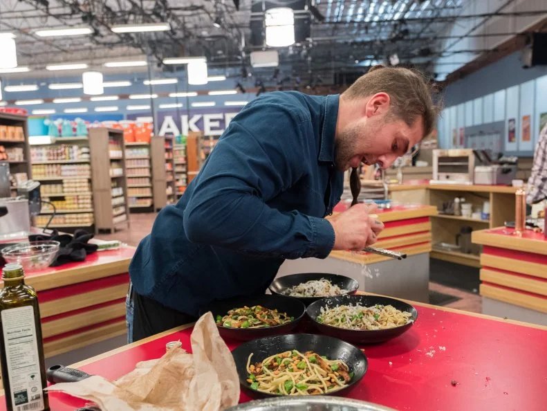 Contestant Samuel Monsour puts the finishing touches on his dish, as seen on Food Network's Guy's Grocery Games, Season 12.