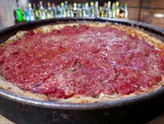 <p>Chicago may be known for deep-dish pies, but Lou Malnati&rsquo;s serves a thin-crust creation that has won over legions of pizza lovers. Known as the Loaded Combo Pizza, this pie features a butter-brushed crust and a bevy of toppings (think pepperoni, sausage and black olives). Another popular pie is the Malnati Chicago Classic, which comes covered with sausage, local mozzarella and vine-ripened tomato sauce. There&rsquo;s even a take on that iconic deep-dish pie. &ldquo;Lou Malnati&rsquo;s deep-dish pizza is one of the best dishes you can eat in Chicago, period,&rdquo; says Ken Oringer. He&rsquo;s partial to The Lou: a deep-dish pie that pulls in baby spinach, mushrooms, Roma tomatoes and four types of cheeses to create a &ldquo;mac and cheese-type crust&rdquo; Oringer says.</p>
