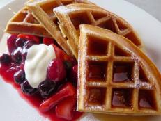 <p>&ldquo;It is my go-to place for brunch,&rdquo; says Iron Chef Zakarian. When a sweet craving hits, he orders the sour cream hazelnut waffles. Warm berries and whipped cr&egrave;me fraiche are the finishing flourish to this perfect dish. If he&rsquo;s craving savory, Iron Chef Zakarian goes for the quiche with its trancendant triumvirate of roasted pepper, caramelized onion and gruyere. &ldquo;It&rsquo;s magic,&rdquo; he says. &ldquo;It&rsquo;s the perfect little slice of breakfast.</p>
<p>On The Best Thing I Ever Ate, Bobby didn't hesitate in naming Balthazar's French Fries as the perfect crunch food. Locals also swear by this brasserie's perfection of all foods Parisian, like Steak Frites and Boudin Noir. Pressed for time? Stop by the bakery next door and snag a crunchy baguette.</p>