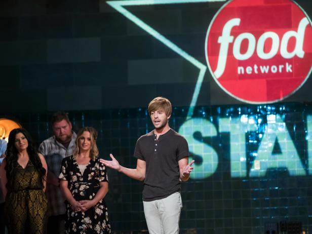 Contestants (left) Addie Gundy, Cory Bahr, Suzanne Lossia, Rusty Hamlin and Amy Pottinger (right) behind contestant Trace Barnett introducing himself for the Mentor Challenge, Ready, Set...Rehearse!, as seen on Food Network Star, Season 13.