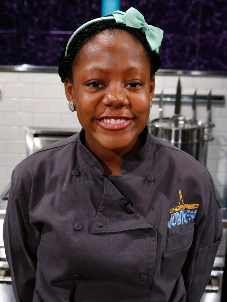 Junior chef Tavia Isaac poses, as seen on Chopped Junior, Season 7.