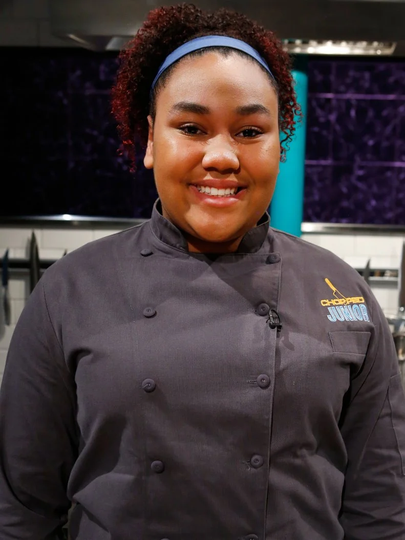 Junior chef Aziza Eshun poses, as seen on Chopped Junior, Season 7.