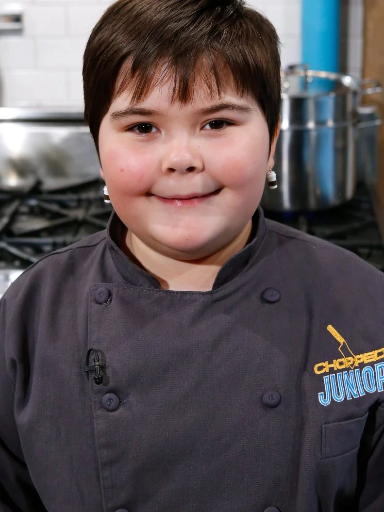 Junior chef Lucy Chelton poses, as seen on Chopped Junior, Season 7.