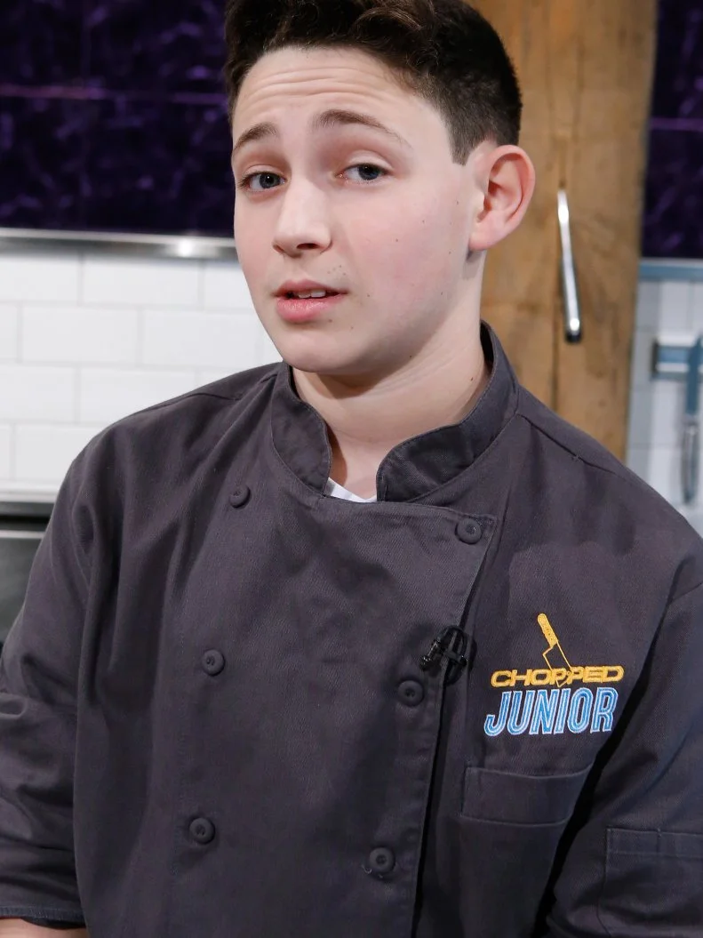 Junior chef Aidan Friedson poses, as seen on Chopped Junior, Season 7.
