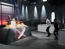 Host Alton Brown with Iron Chefs Bobby Flay, Masaharu Morimoto, Michael Symon and Chef Stephanie Izard during the reveal of the Pepper Battle, as seen on Iron Chef Gauntlet, Season 1.