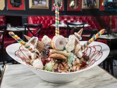 <p class="MsoNormal">The Sugar Factory is like Candyland for adults. Jeff and Audrey Dunham showed up to taste The King Kong Sundae. The gargantuan creation features 24 scoops of ice cream with an avalanche of insane toppings including a whole doughnut, an entire chocolate chip cookie and red velvet cake. To top it off, sparklers herald the arrival of the gut-busting mountain of ice cream. Jeff dubbed it, &ldquo;the ultimate dessert.&rdquo;</p>