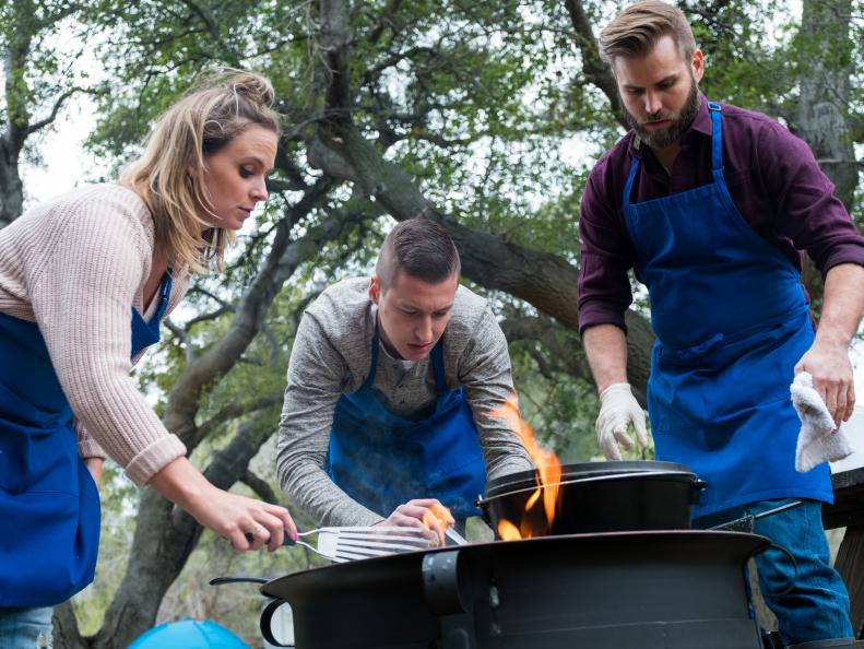 Contestants Amy Pottinger, Matthew Grunwald and Cory Bahr preparing their dishes for the Star Challenge Camping to Glamping, as seen on Food Network Star, Season 13.