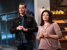 Hosts Jeff Mauro and Alex Guarnaschelli observing contestants competing in the challenge #SnackandaHack, as seen on Star Salvation for Food Network Star, Season 13.
