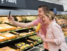 Contestants Matthew Grunwald and Addie Gundy film their Instagram Story at Walmart for the Mentor Challenge Shopping and Cooking on a Budget / Instagram, as seen on Food Network Star, Season 13.