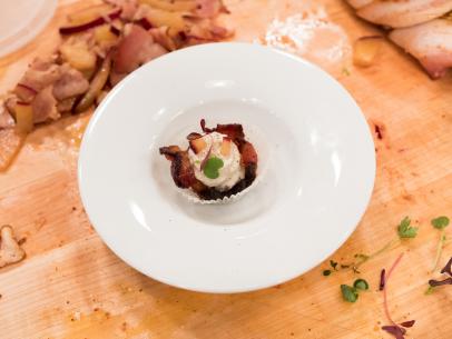 Contestant Addie Gundy's dish, Jalapeno Bacon Cup Bite with Creamy Blue Cheese and Plum, for the challenge Party Like an Iron Chef, as seen on Star Salvation for Food Network Star, Season 13.