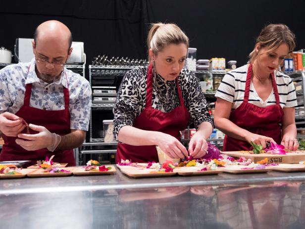 Contestants Jason Smith, Addie Gundy and Amy Pottinger plate their first course, Tropical Jungle Skirt Steak w/ Mango Berry Salsa, for the Star Challenge Experiential Restaurant, as seen on Food Network Star, Season 13.