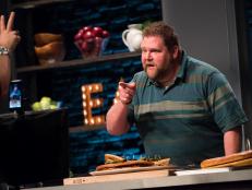 Contestant Rusty Hamlin presents his dish, OMG Burger, for the Mentor Challenge Ginormous Food, as seen on Food Network Star, Season 13.