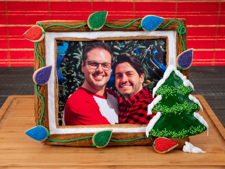 Contestant Ricky Webster's dish photo of Ricky and Boyfriend, Pecan Sugar Cookie with Cinnamon Royal Icing, and Spicy Gingerbread with Vanilla Royal Icing, during the second round, The Display Challenge, "Cookie Photo Frames", as seen on Christmas Cookie Challenge, Season 2.