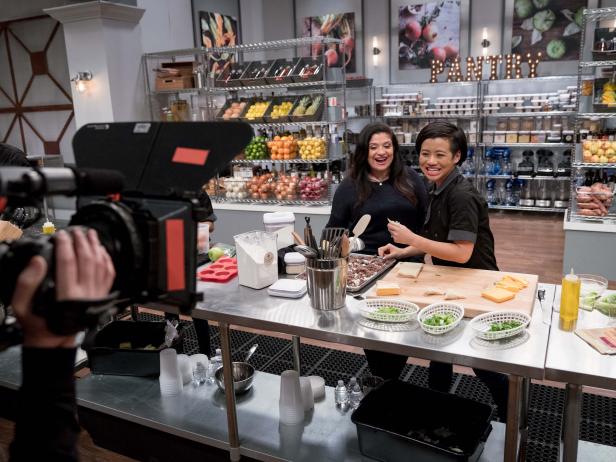(Left to Right) Host Alex Guarnaschelli with Contestant Jess Tom during the "Classic on the Go Challenge", as seen on Star Salvation for Food Network Star, Season 14.