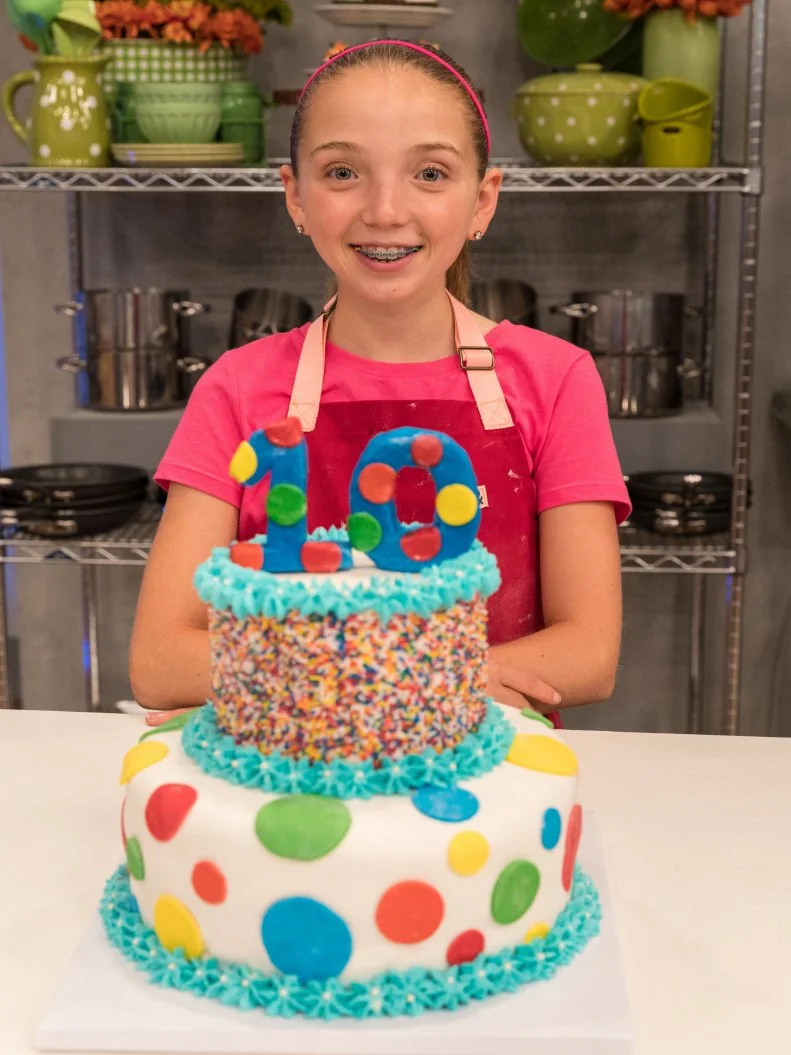 Contestant Abby Martin's completed dish from the main heat challenge, Vanilla Bean with Strawberry and Lime Buttercreams and Vanilla Buttercream Frosting, as seen on Food Network's Kids Baking Championship Season 4