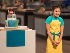 Contestant Linsey Lam presents her dish from the main heat challenge to the judges, as seen on Food Network's Kids Baking Championship Season 4