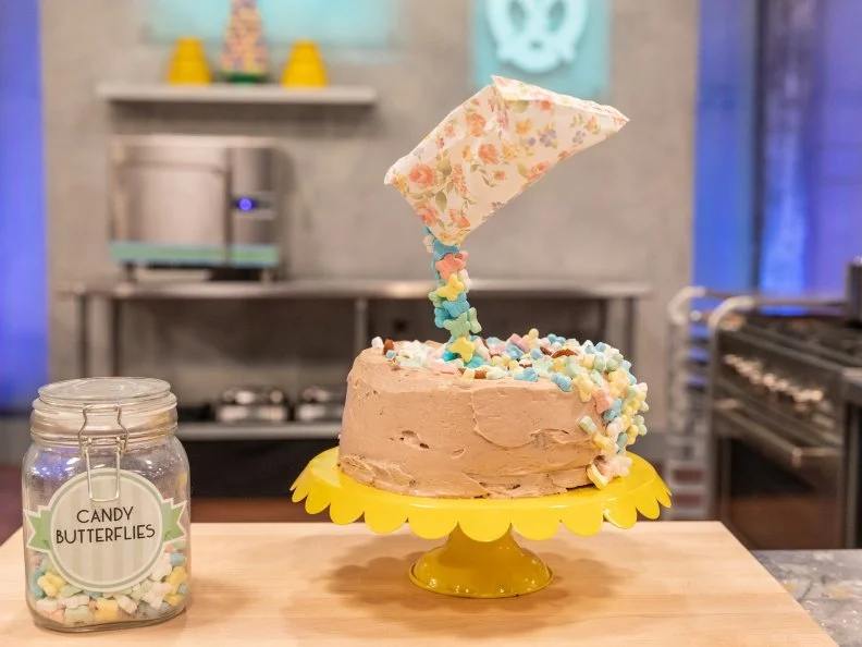 Contestant Mekdes Bass' completed dish from the main bake, Vanilla cake wiith chocolate buttercream frosting and sauteed fresh ginger pieces, as seen on Kids Baking Championship Season 5.