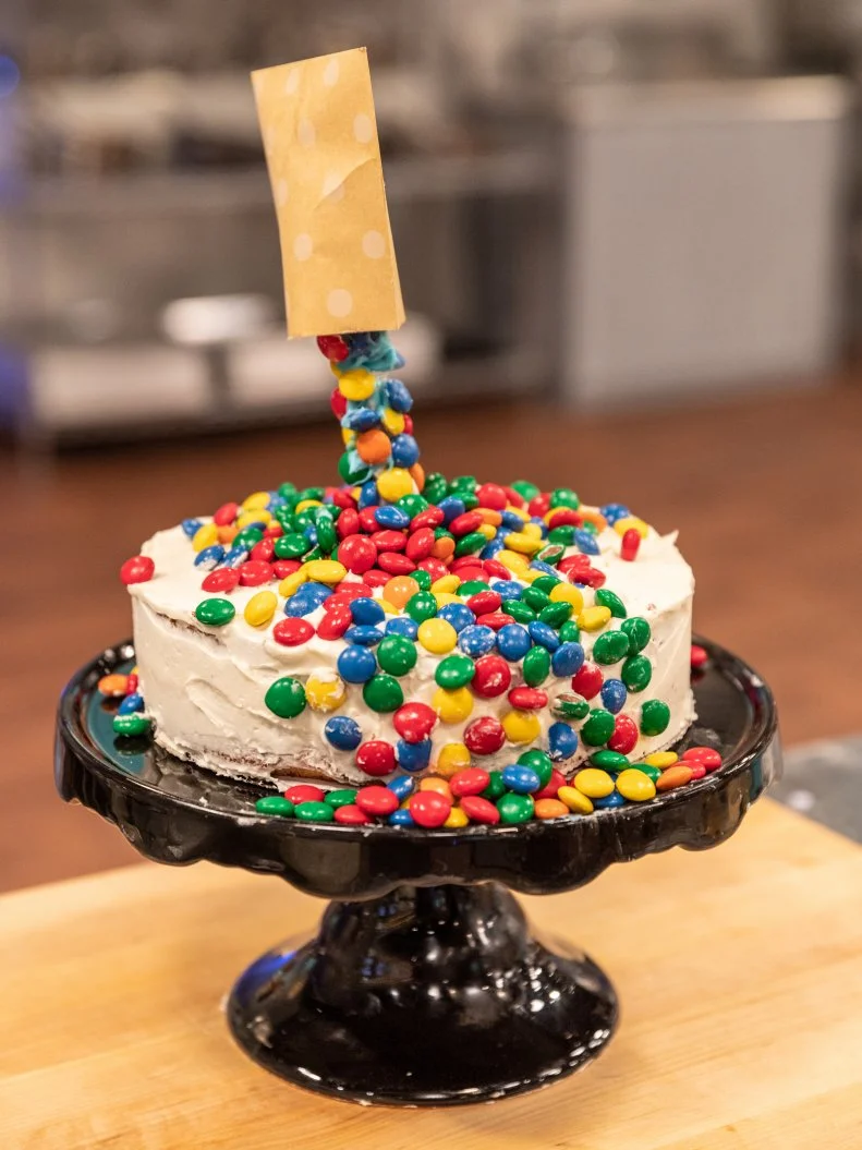 Contestant Saylor Herrin's completed dish from the main bake,  Lime cake with raspberries and fresh ginger buttercream, as seen on Kids Baking Championship Season 5.