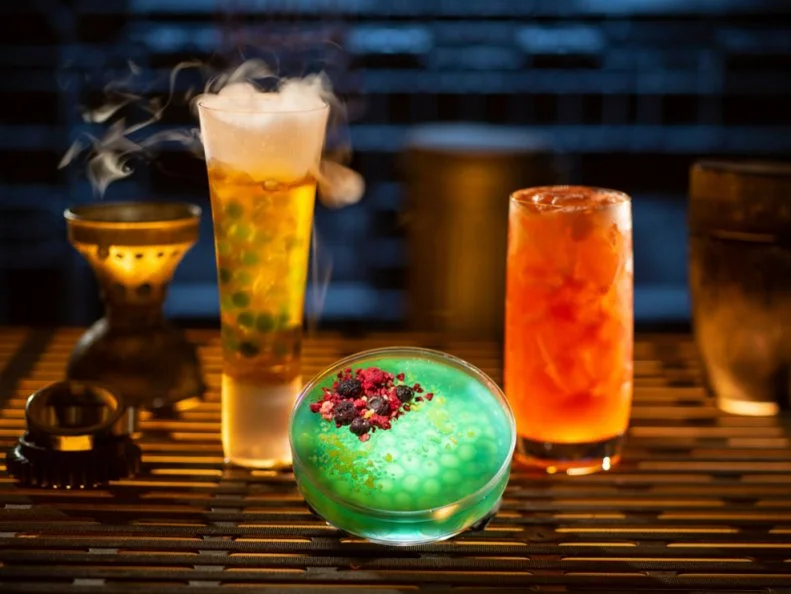 Innovative and creative drinks from around the galaxy will be available at Star Wars: Galaxy’s Edge when it opens  May 31, 2019, at Disneyland Park in Anaheim, Calif., and Aug. 29, 2019, at Disney's Hollywood Studios in Lake Buena Vista, Fla. Left to right, non-alcoholic drinks: Carbon Freeze, Oga’s Obsession provision and Cliff Dweller can be found at Oga’s Cantina inside Star Wars: Galaxy’s Edge. (Kent Phillips/Disney Parks)