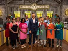 Host Clinton Kelly poses with contestants for a photo, as seen on Spring Baking Championship, Season 5.