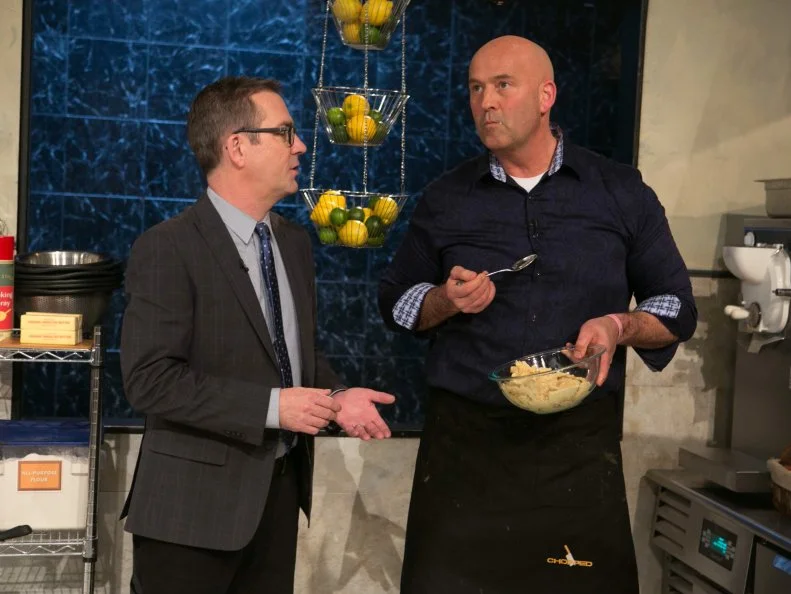 Chopped host Ted Allen checks in on amateur chef Keith Young as he works on his dessert that must include: cookie spread, creme anglaise, grapefruit and microwave mug cupcakes as he competes for a slot in the Chopped Ultimate Championship competition, the winner of which receives $50,000 and a new car from Buick, as seen on Food Network's Chopped, Season 21.