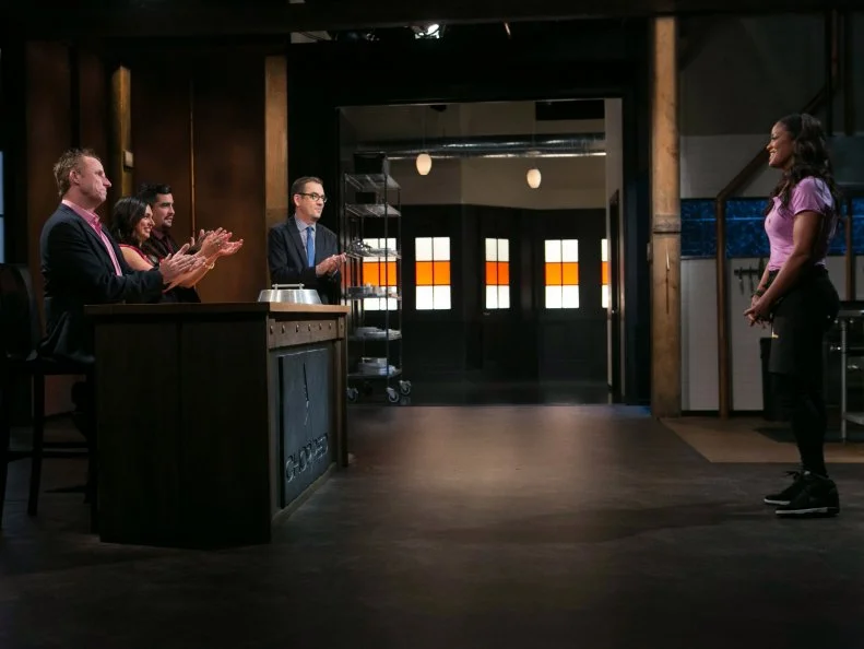 Celebrity chef Laila Ali reacts to chopped host Ted Allen with judges: Marc Murphy, Maneet Chauhan and Aaron Sanchez moments after finding out she has won a slot in the Chopped Ultimate Championship competition, the winner of which receives $50,000 and a new car from Buick, as seen on Food Network's Chopped, Season 21.