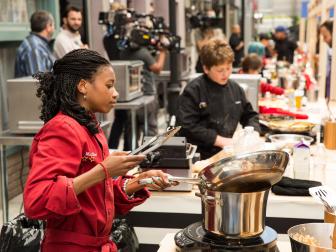 Contestant Madison Grant (TR) cooks at her station as seen on Food Network's Rachael vs. Guy: Kids Cook-Off, Season 2