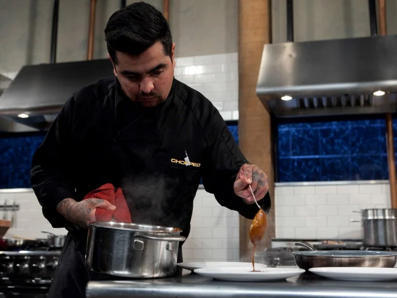 Chopped: After Hours chef Aaron Sanchez working on his entree that must include: Chocolate cake pops, white chocolate cocoa mix, quail and Serrano peppers, as seen on Food Network's Chopped: After Hours.