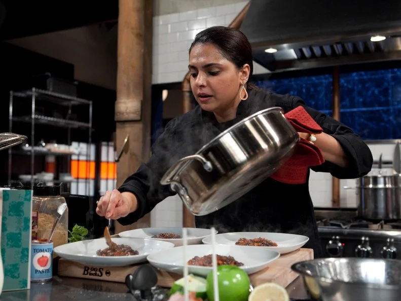 Chopped: After Hours chef Maneet Chauhan working on her entree that must include: Chocolate cake pops, white chocolate cocoa mix, quail and Serrano peppers, as seen on Food Network's Chopped: After Hours.