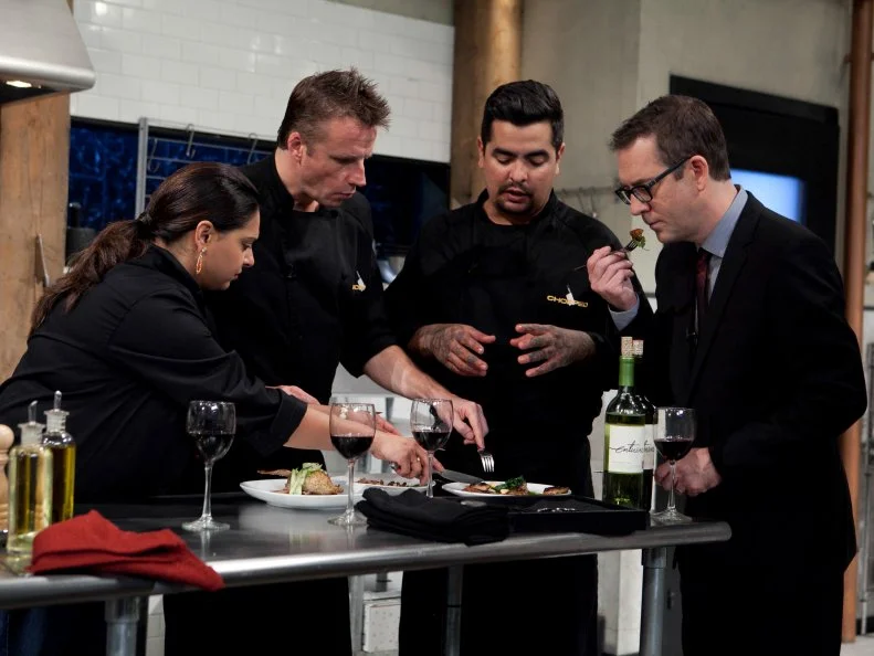 Chopped: After Hours host Ted Allen and chefs: Aaron Sanchez, Marc Murphy and Maneet Chauhan taste the entrees the chefs made that must include: Chocolate cake pops, white chocolate cocoa mix, quail and Serrano peppers, as seen on Food Network's Chopped: After Hours.
