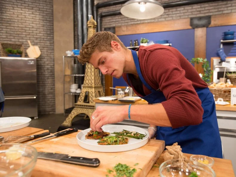 Contestant Joe Slaughter cooks as seen on Food Networkâ  s Worst Cooksin America, Season 5.