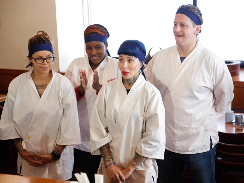 Both teams await the results of which will the Sushi Skill Drill Challenge. The Red and Blue team recruits must prepare two sushi dishes for a hungry lunchtime crowd and are tested on both their time & quantity: A California Roll with snow crab, nori, rice on the outside, garnished with sesame seeds and a Salmon Roll with sliced salmon, scallion, sushi rice, spicy mayo (with nori on the outside.)  The diners will determine which team will the challenge, as seen on Food Network's Worst Cooks in America, Season 5.