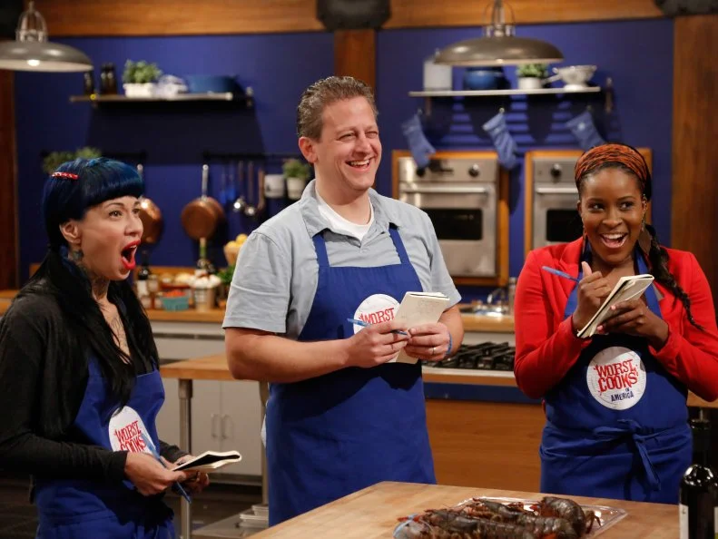 Chef Bobby Flay surprises his recruits with live lobsters which they will have to prepare as part of the Surf and Turf Challenge. For this challenge, each team must replicate surf and turf dishes demonstrated to them by their team leader; Grilled Ribeye with Fra Diavolo Lobster Relish by Chef Bobby Flay for the Blue Team, and Dry Rubbed Rib Eye with Chili Lobster by Chef Anne Burrell for her Red Team. The Blue Team recruits are:  Amber Brauner, Daniel Beyda and Stephanie St. Aubin, as seen on Food Network's Worst Cooks in America, Season 5.
