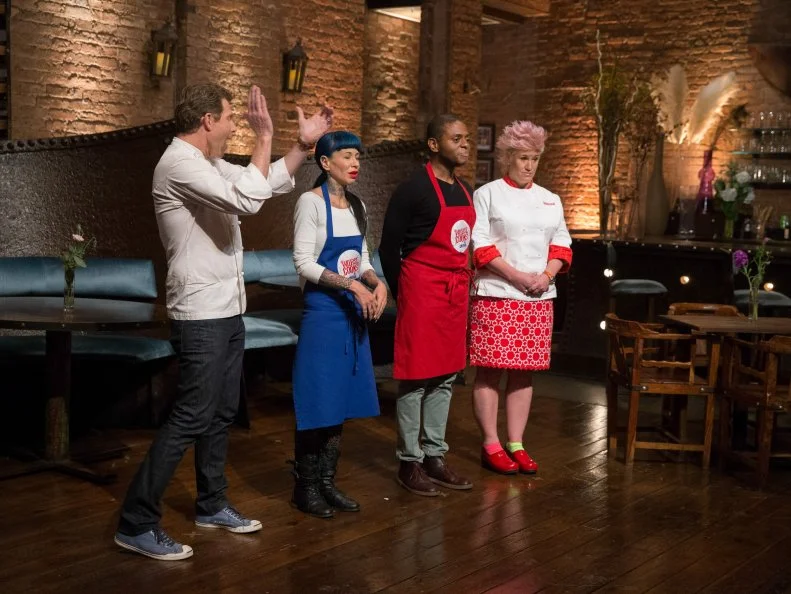 Chef Bobby Flay with Amber Brauner as Chef Anne Burrell stands with Jamie Thomas on set for the final episode as seen on Food Network's Worst Cooks in America, Season 5.
