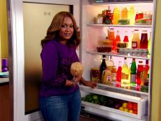 Sunny Anderson removes a jicama from her refrigerator drawer to use in her slaw.
